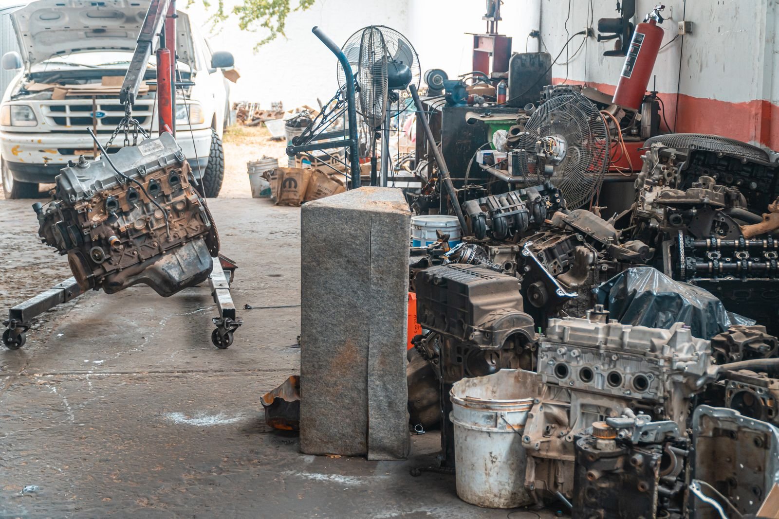 VAG engine parts and components laid out in a workshop, matched against ETKA 8.6 parts catalog data
